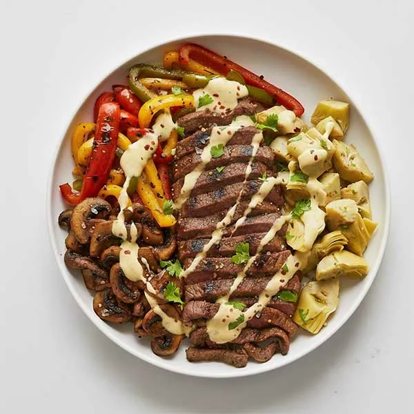 Philly Cheese Steak Bowl With Char Pepper, Grilled Mushrooms, Lime Artichoke & Jalapeno Cheese Sauce